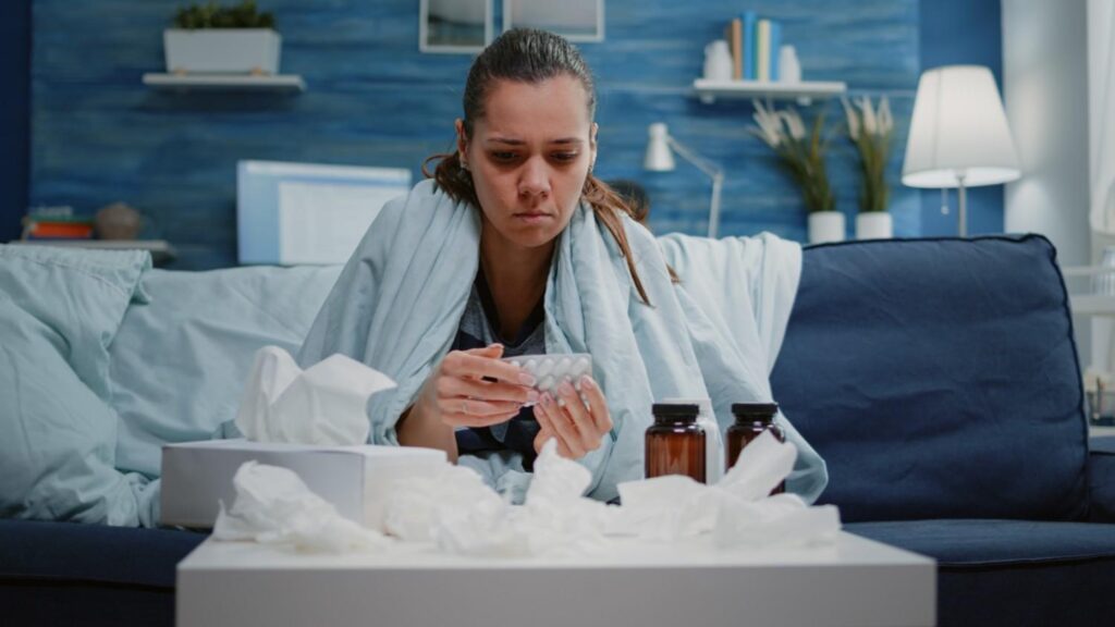 Woman feeling overheated indoors during UK summer while on sertaline